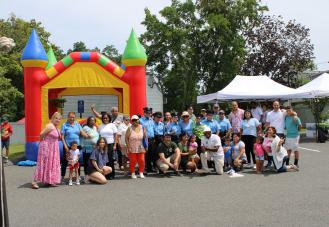 Group of people in front of bouncy castle