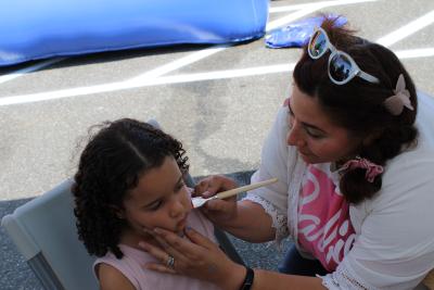 Girl getting face painted