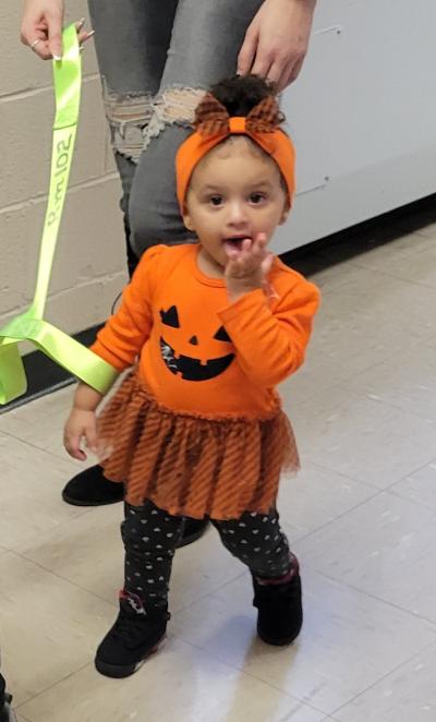 Little girl dressed as pumpkin